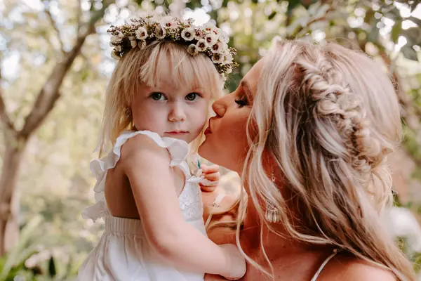 Flower girl with the bride on the wedding morning