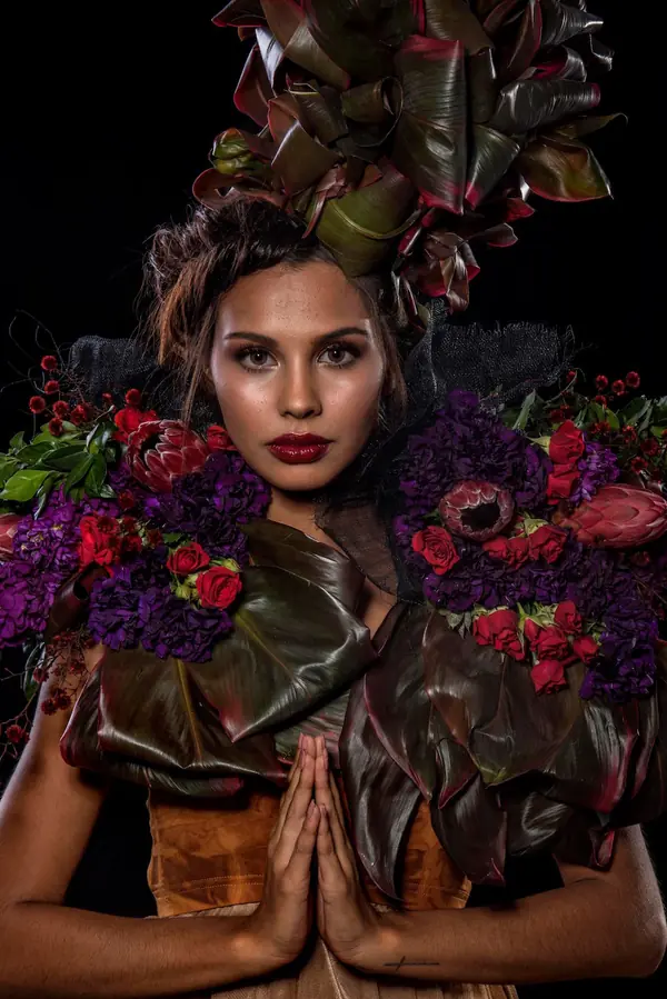 Floral headpiece editorial with hands in prayer