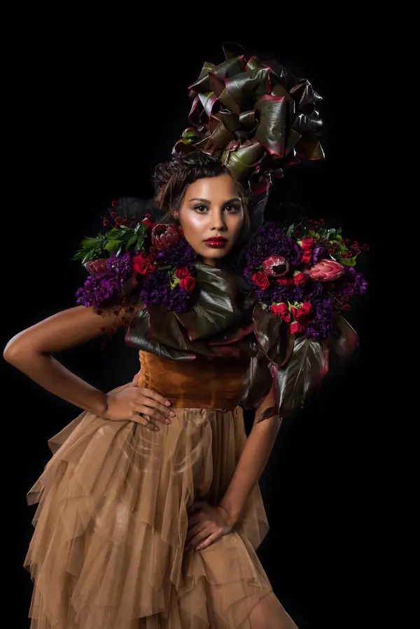 Full-length floral headpiece editorial on black