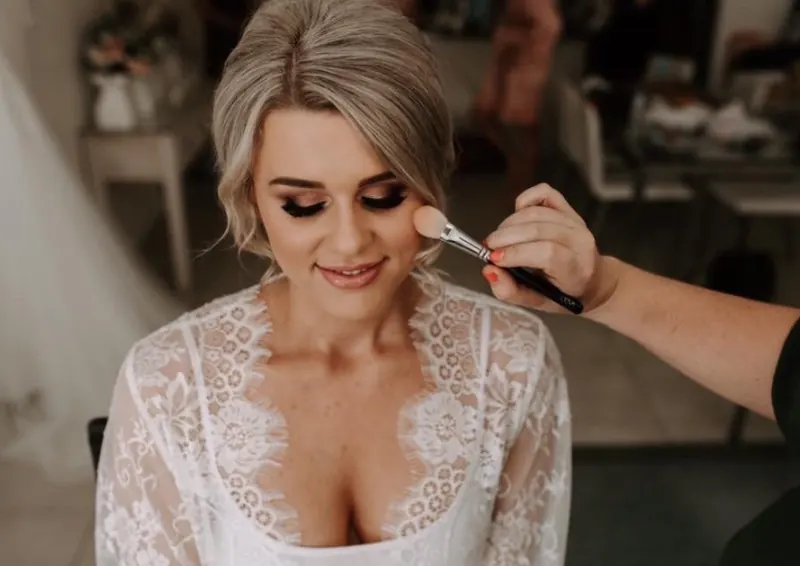 Jess having her bridal makeup applied